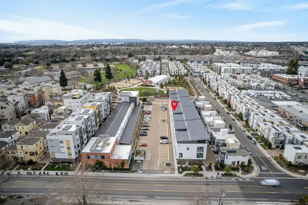 an aerial view of a house with a ocean view