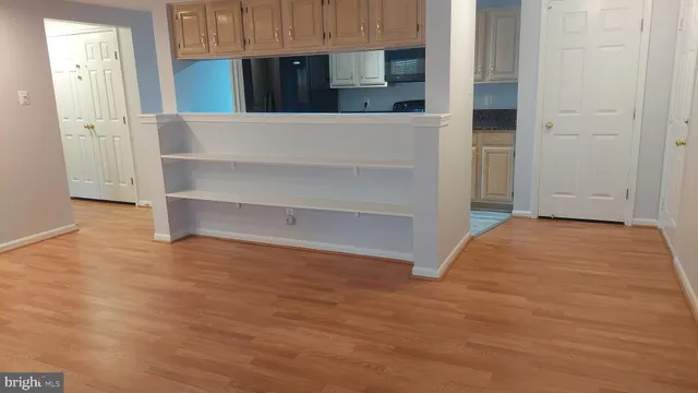 a close view of a microwave and cabinets in a room