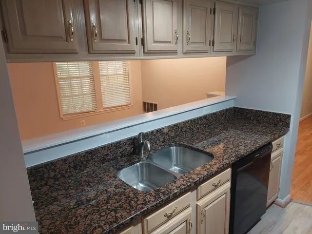 a view of a kitchen in an empty room