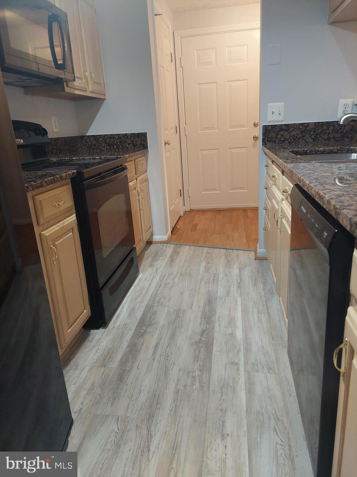13107 Briarcliff Terrace, Unit 2203 Germantown, MD 20874 - Photo 28 of 53 a view of a kitchen in an empty room