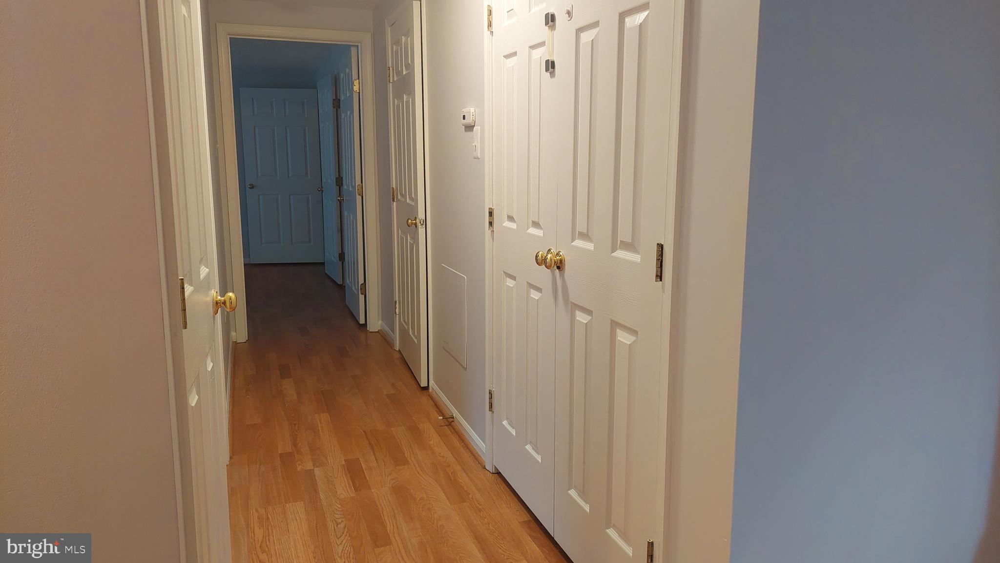 13107 Briarcliff Terrace, Unit 2203 Germantown, MD 20874 - Photo 29 of 53 a view of a hallway with a wooden floor