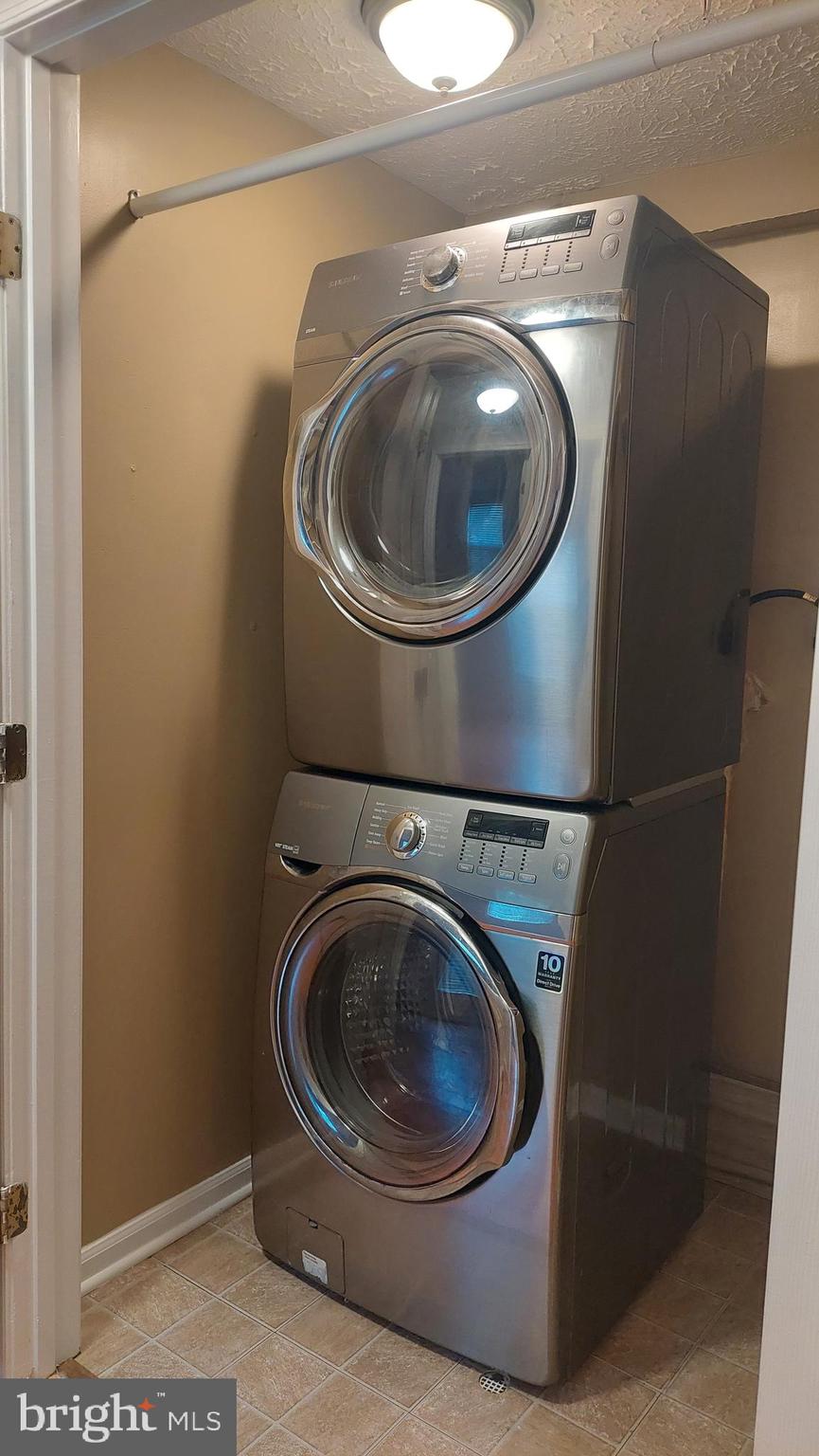 13107 Briarcliff Terrace, Unit 2203 Germantown, MD 20874 - Photo 33 of 53 a utility room with dryer and washer