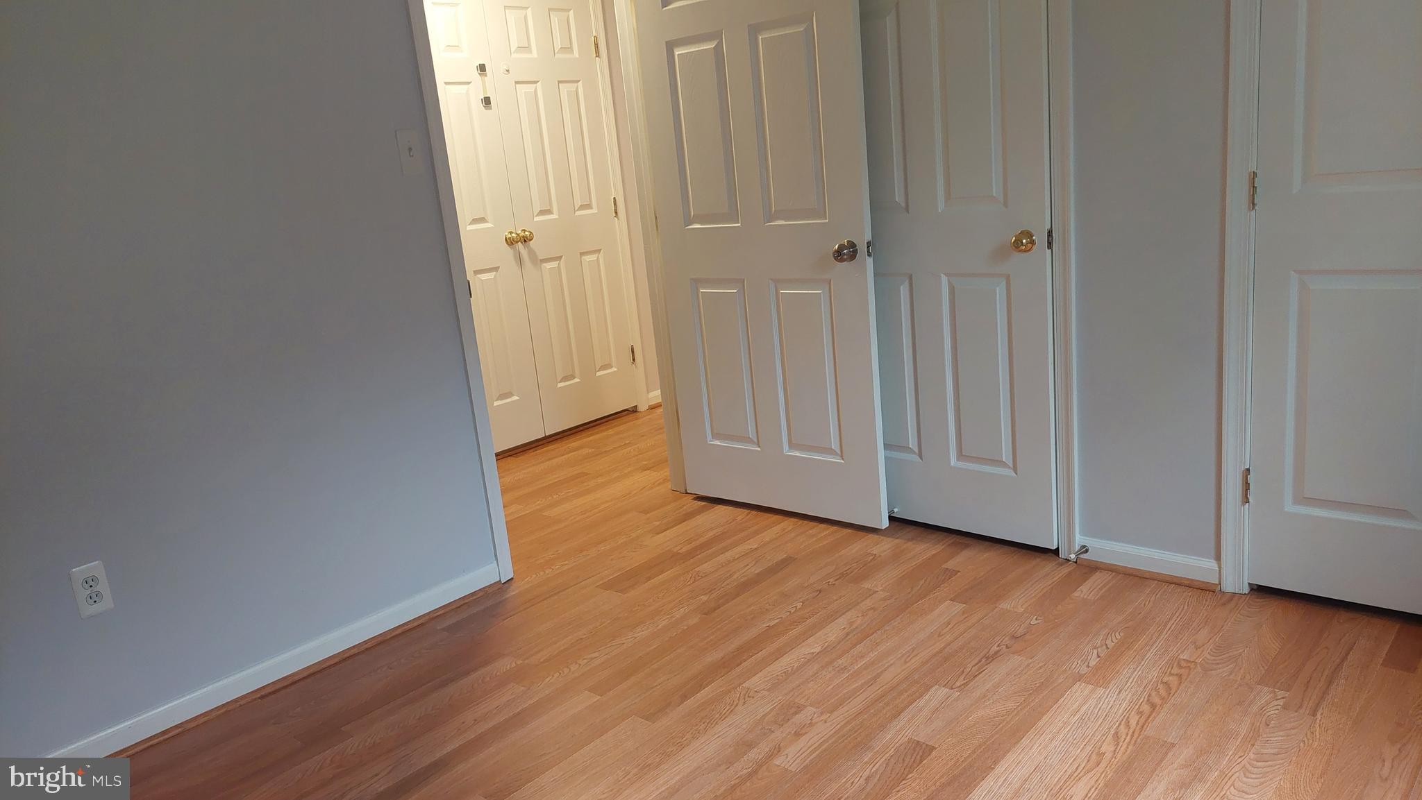 13107 Briarcliff Terrace, Unit 2203 Germantown, MD 20874 - Photo 37 of 53 a view of an empty room with wooden floor