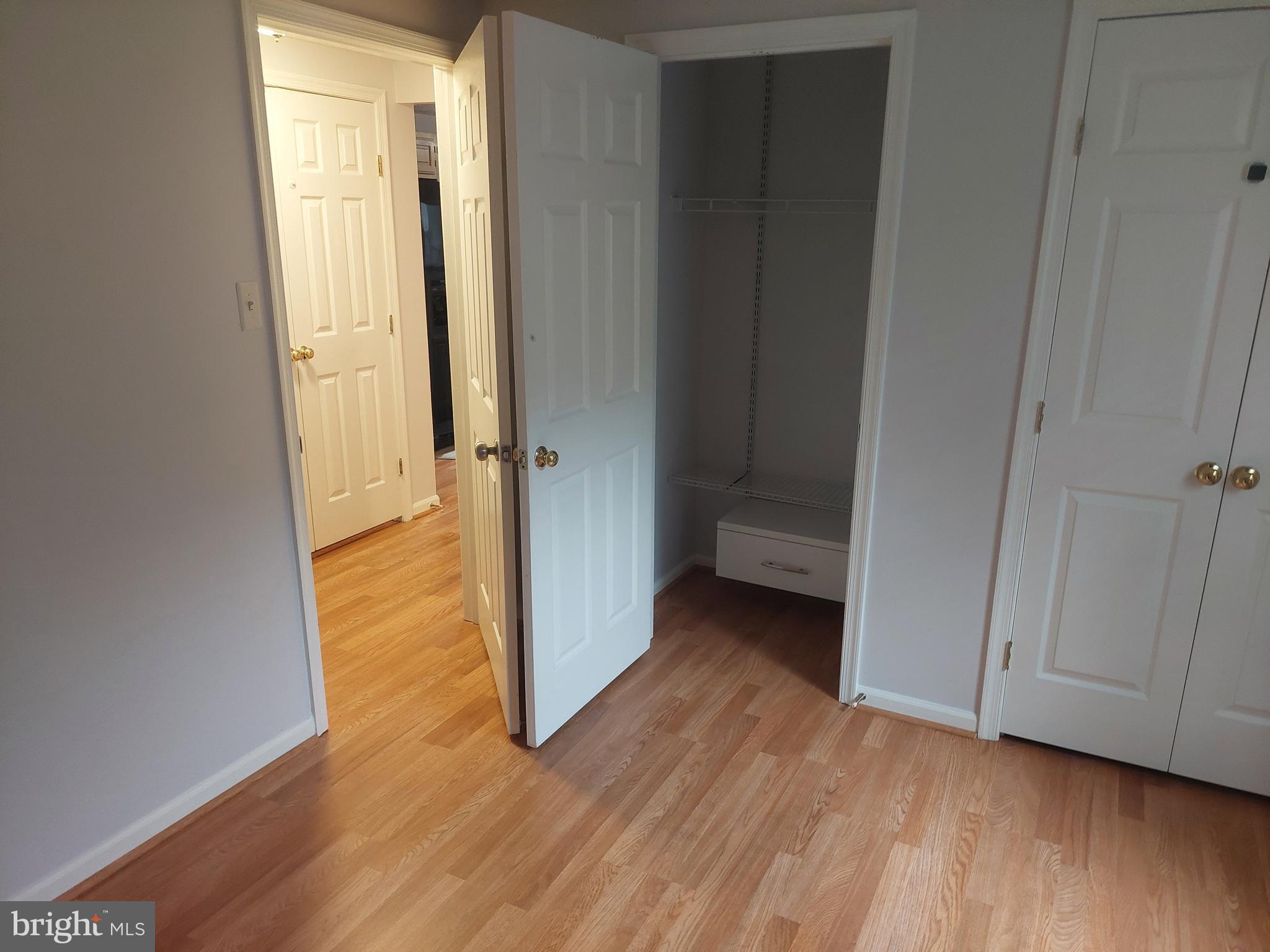13107 Briarcliff Terrace, Unit 2203 Germantown, MD 20874 - Photo 38 of 53 a view of a hallway with wooden floor