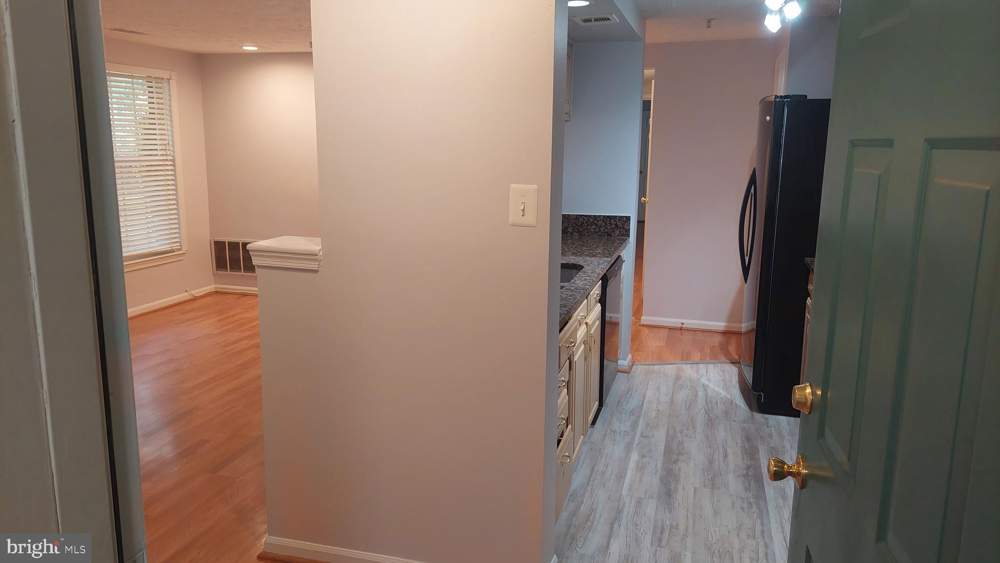 13107 Briarcliff Terrace, Unit 2203 Germantown, MD 20874 - Photo 6 of 53 a view of hallway with wooden floor