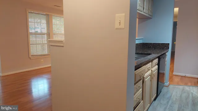 a kitchen with a refrigerator and a stove
