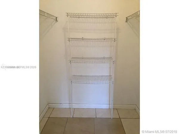 a view of a room that has a window in it