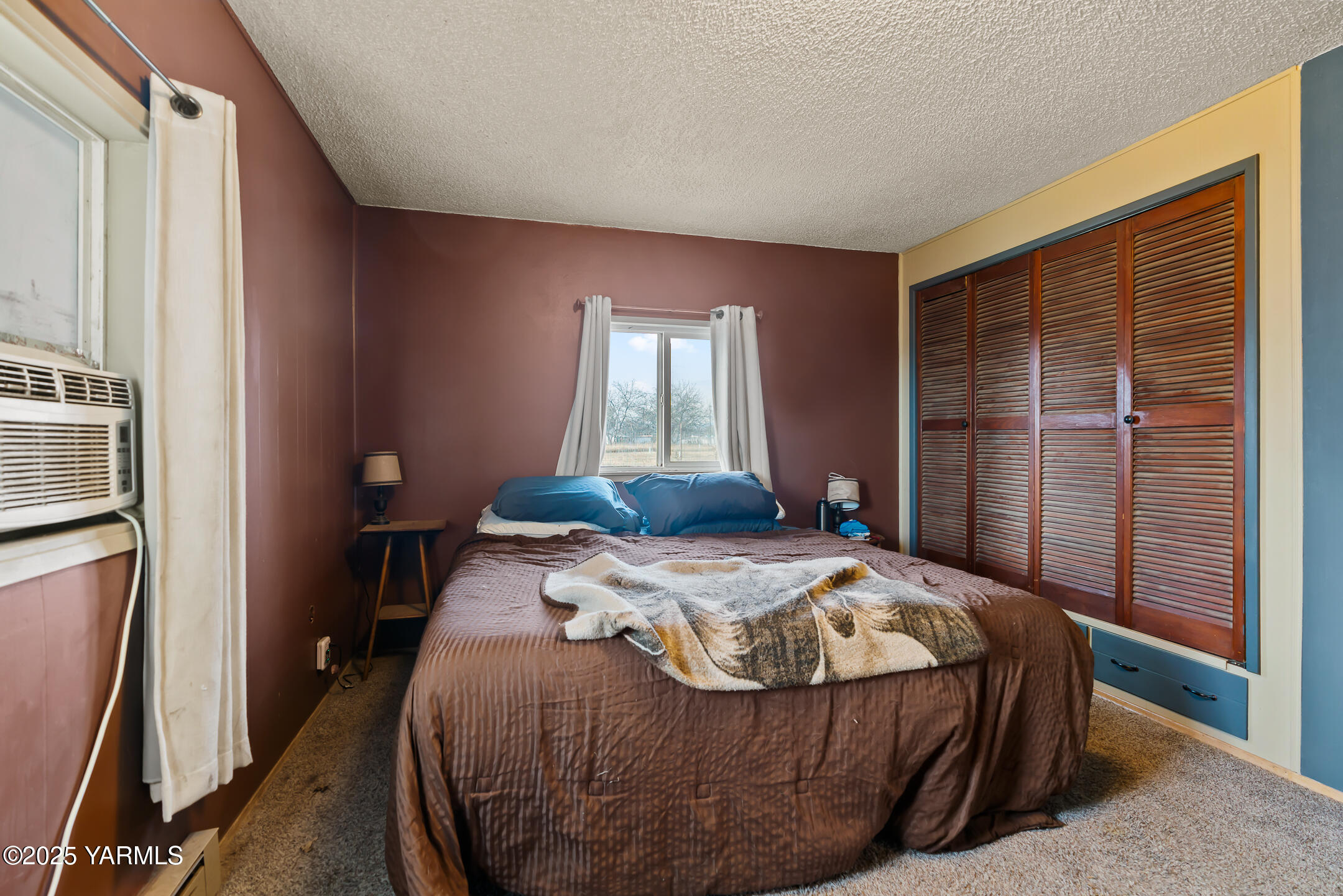 1803 Riverside Road Yakima, WA 98901 - Photo 15 of 53 a bedroom with a bed and a window