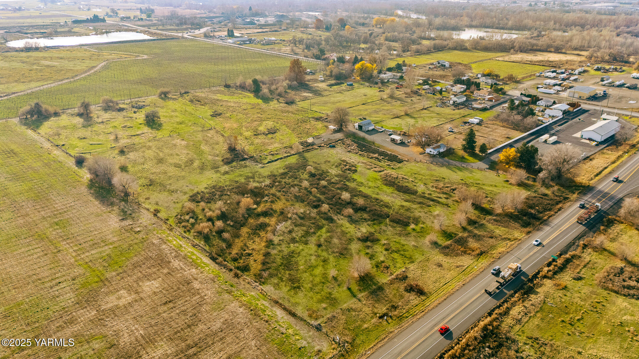 1803 Riverside Road Yakima, WA 98901 - Photo 2 of 53 an aerial view of residential houses with outdoor space