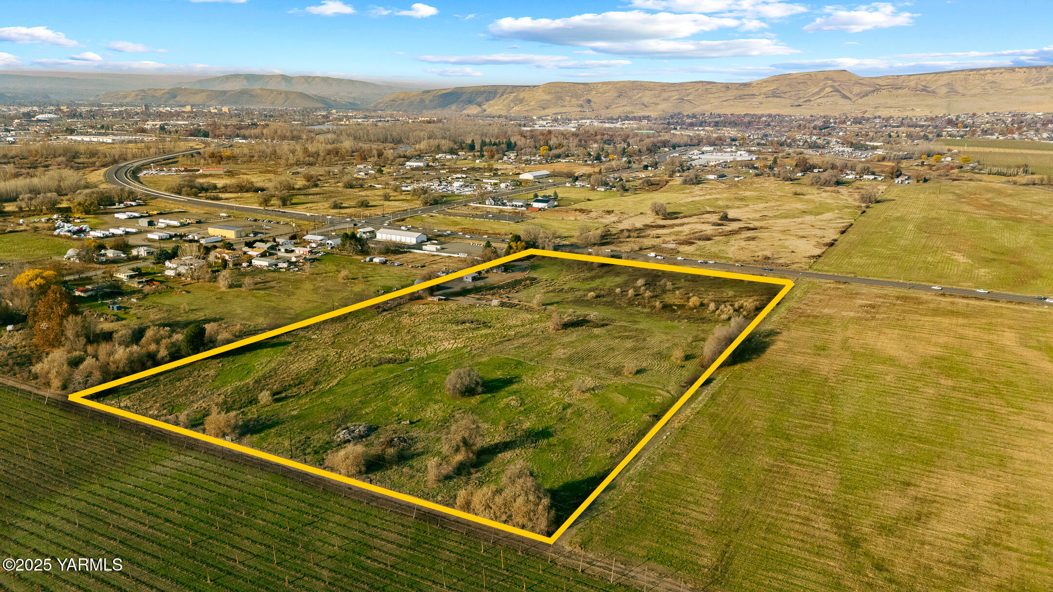 1803 Riverside Road Yakima, WA 98901 - Photo 6 of 53 an aerial view of residential houses with outdoor space