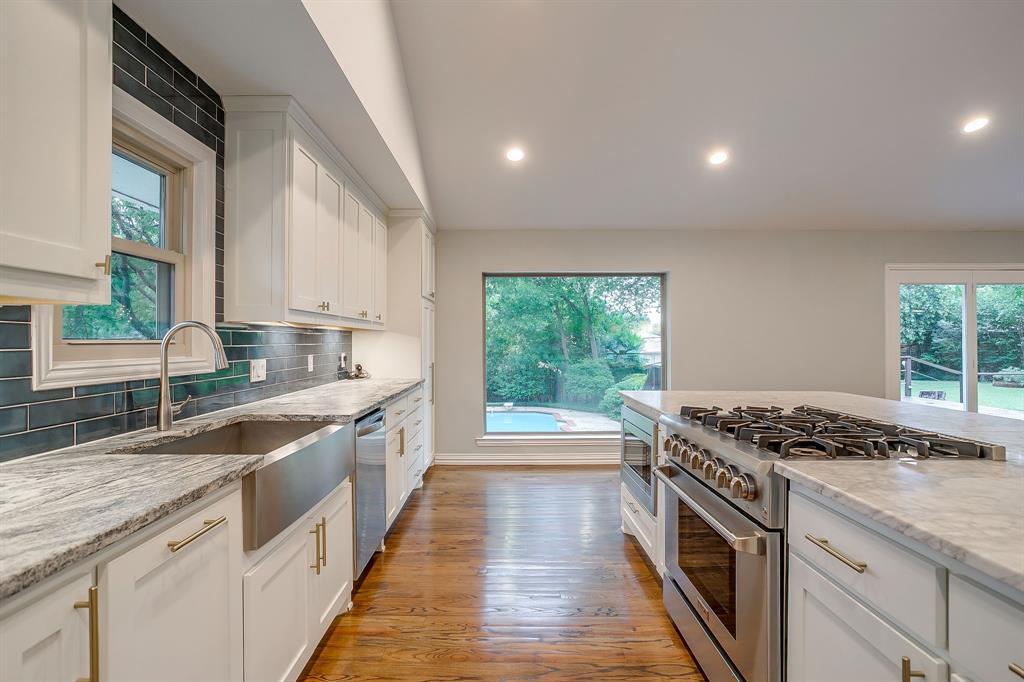 6336 Inca Road Fort Worth, TX 76116 - Photo 13 of 39 a kitchen with stainless steel appliances granite countertop a sink stove and cabinets