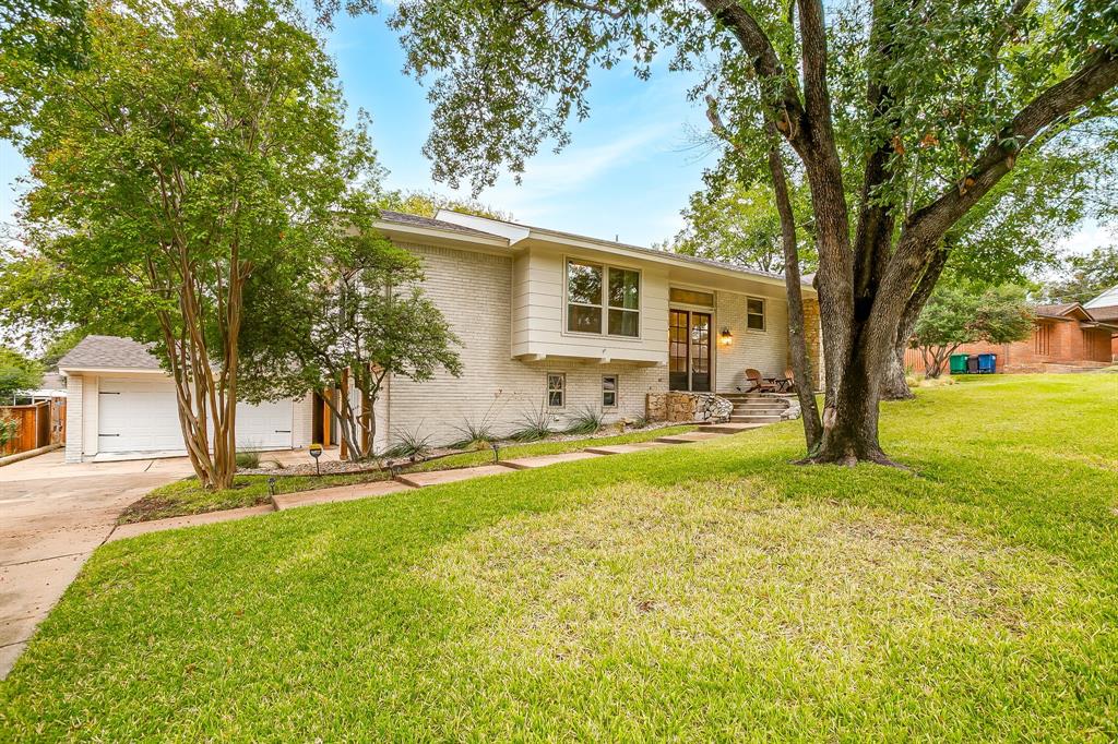 6336 Inca Road Fort Worth, TX 76116 - Photo 2 of 39 a backyard of a house with table and chairs