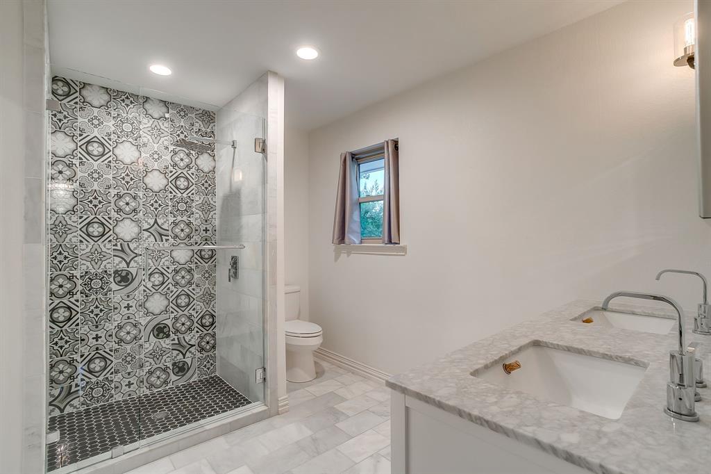 6336 Inca Road Fort Worth, TX 76116 - Photo 28 of 39 a bathroom with a sink toilet and shower