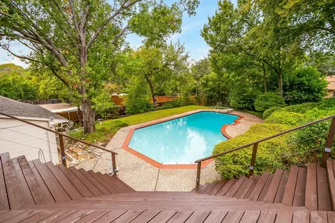 a view of a balcony with chairs