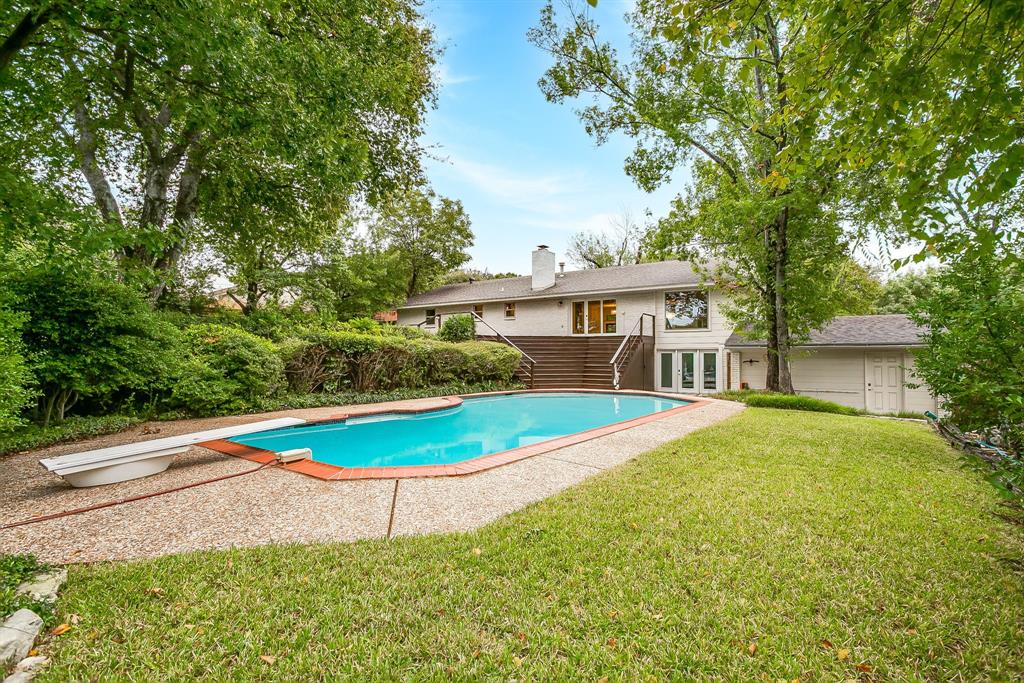 6336 Inca Road Fort Worth, TX 76116 - Photo 38 of 39 a view of a house with swimming pool and a yard
