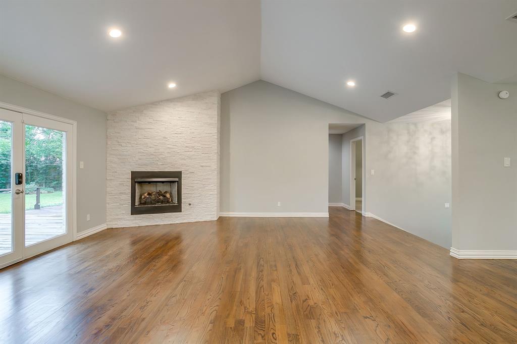 6336 Inca Road Fort Worth, TX 76116 - Photo 7 of 39 a view of an empty room with wooden floor and a window