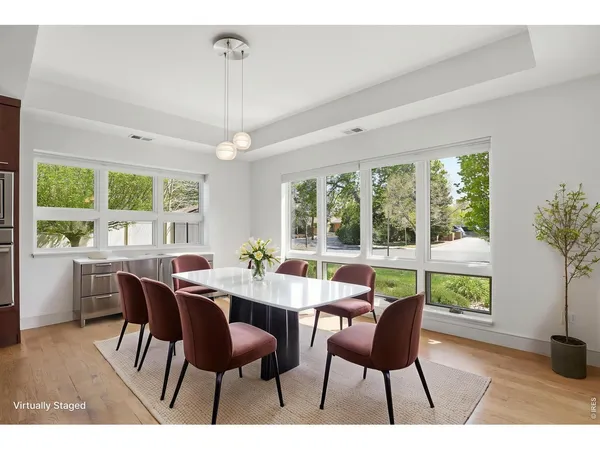 a kitchen with kitchen island granite countertop wooden cabinets and stainless steel appliances