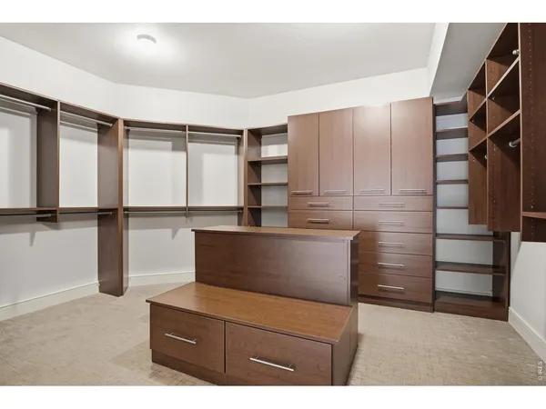 a kitchen with a refrigerator and cabinets