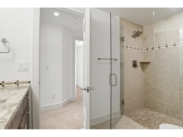 a utility room with cabinets washer and dryer