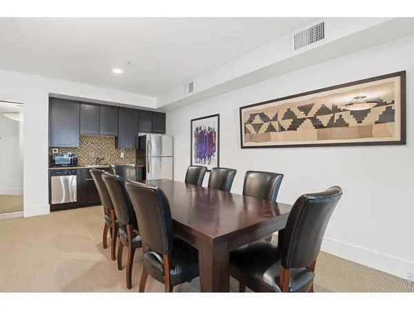 a view of a dining area with furniture and chandelier
