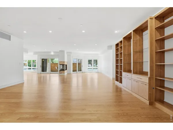 a view of an entryway with wooden floor