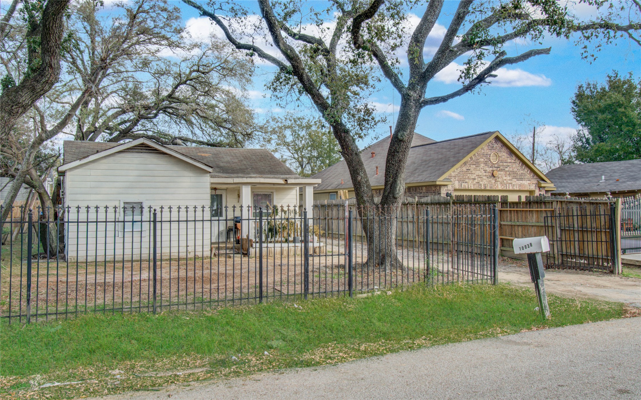 10038 Bamboo Road Houston, TX 77041 - Photo 2 of 36 a view of house with a yard and a large tree
