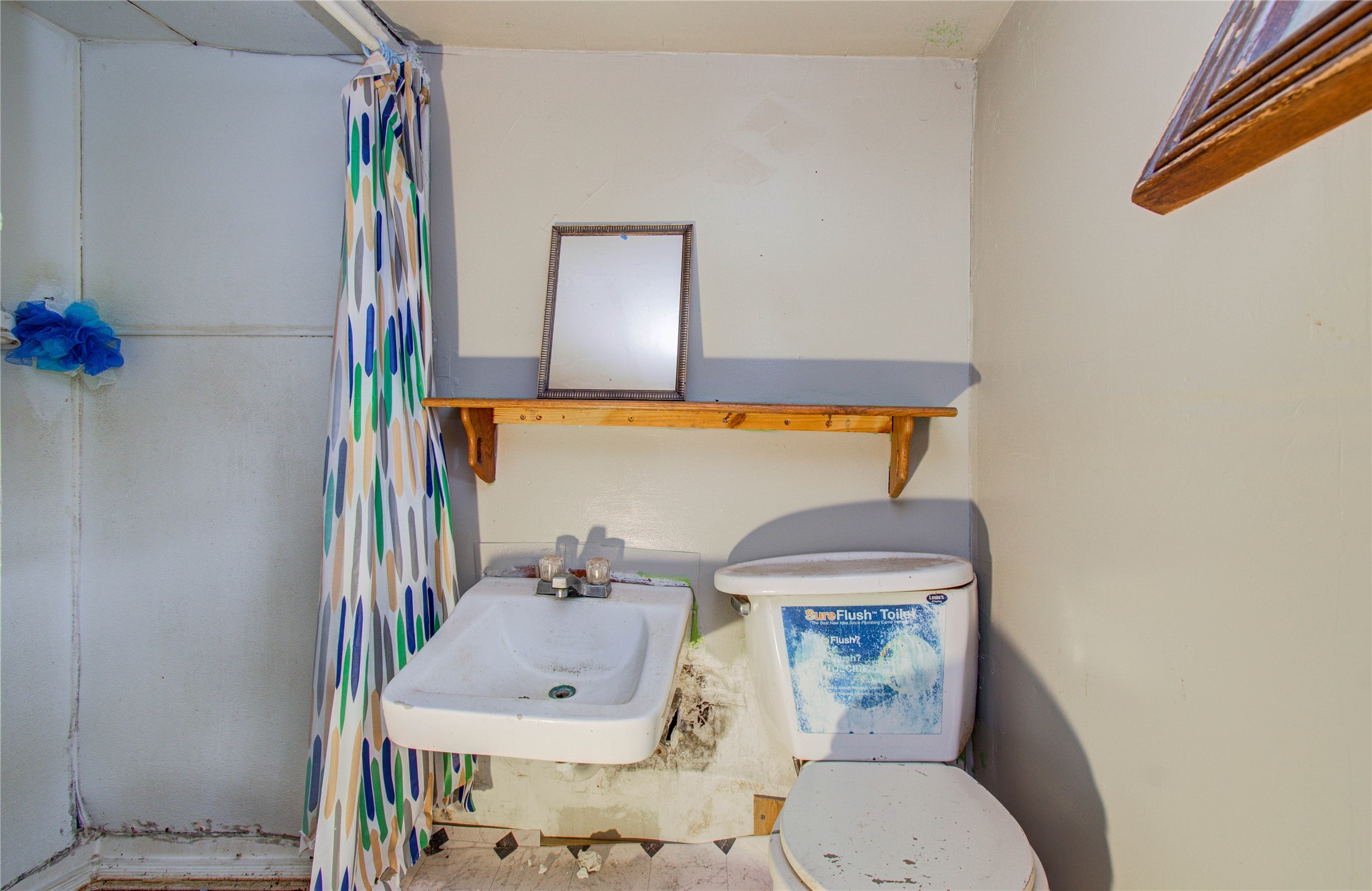 10038 Bamboo Road Houston, TX 77041 - Photo 23 of 36 a bathroom with a toilet and a sink