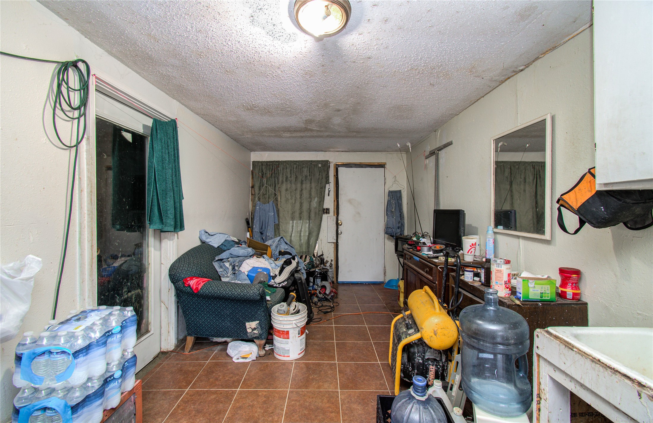 10038 Bamboo Road Houston, TX 77041 - Photo 27 of 36 a living room with furniture and a flat screen tv