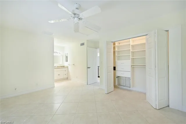 a view of a livingroom with a furniture and a ceiling fan