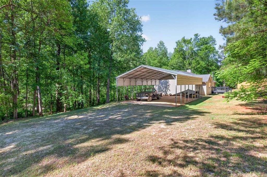 386 Ridgewood Drive Pendergrass, GA 30567 - Photo 33 of 50 a front view of a house with yard and green space