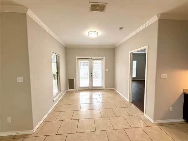 a view of an empty room and window
