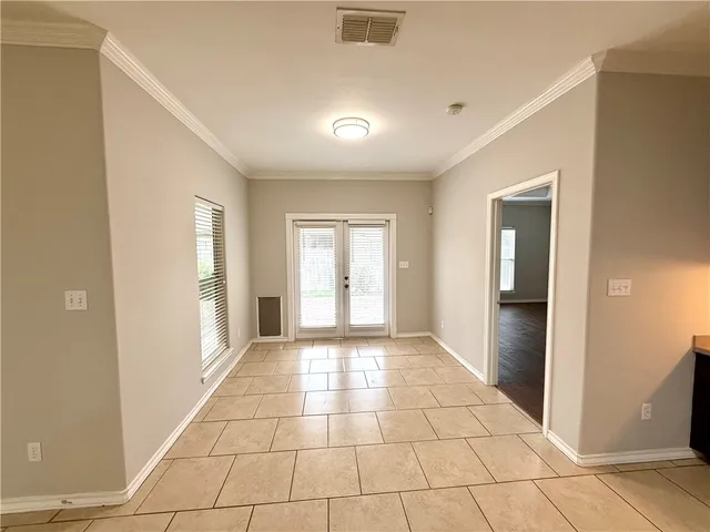 a view of an empty room and window