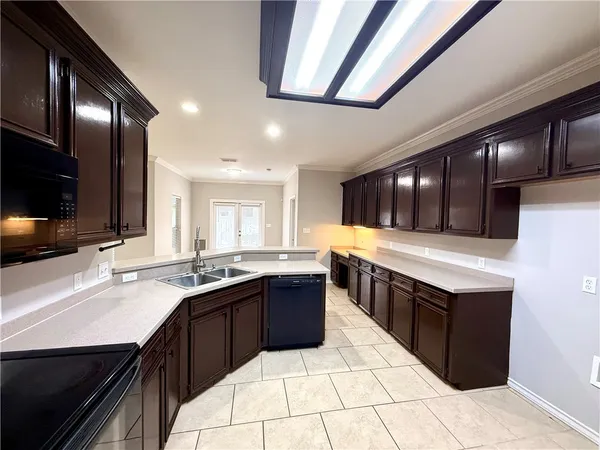 a kitchen with a sink and cabinets