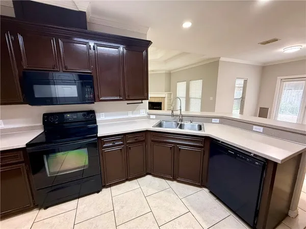 a bathroom with double vanity and a mirror
