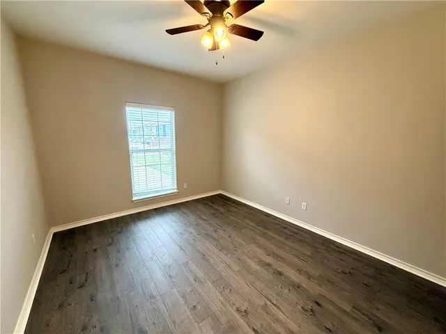 a bathroom with a double vanity sink a mirror and a bathtub
