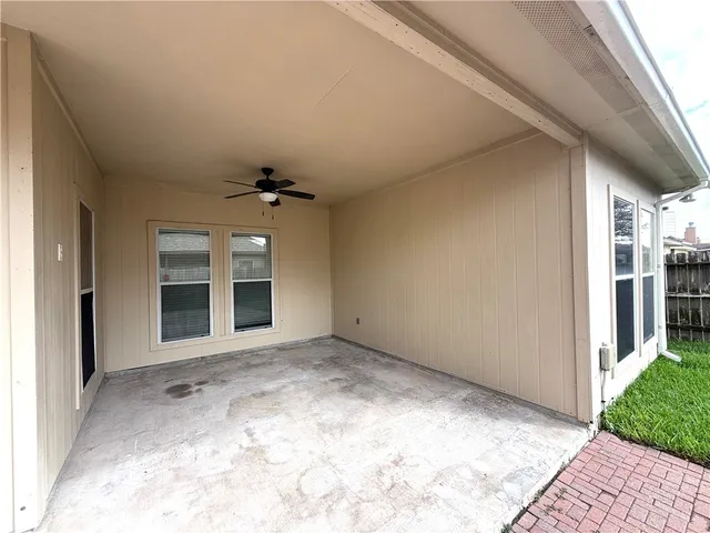 a front view of a house with a yard and garden