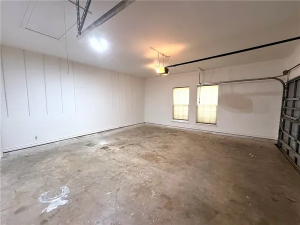 a view of a house with a yard and garage