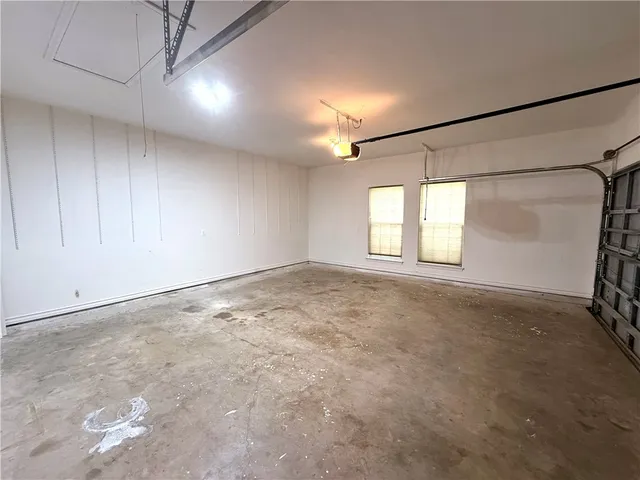 a view of a house with a yard and garage