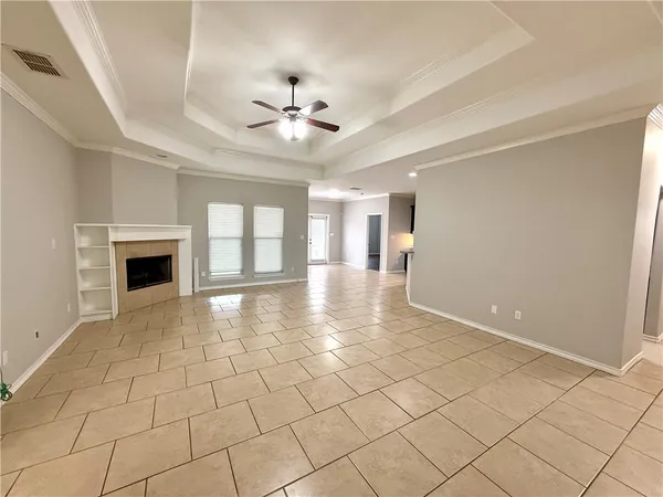 a view of an empty room with a fireplace