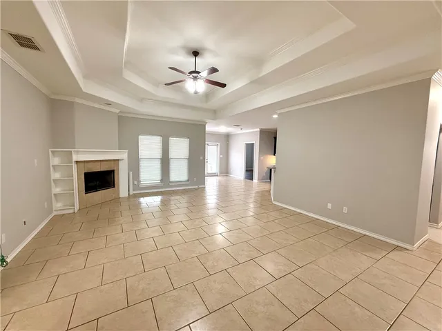 a view of an empty room with a fireplace