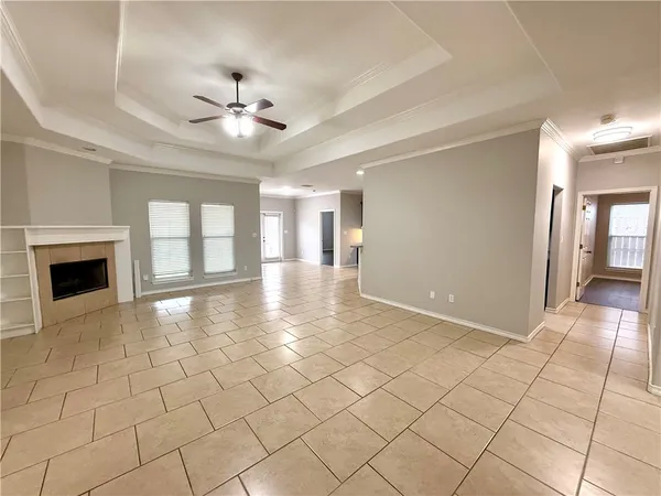 a view of a livingroom with a ceiling fan and window