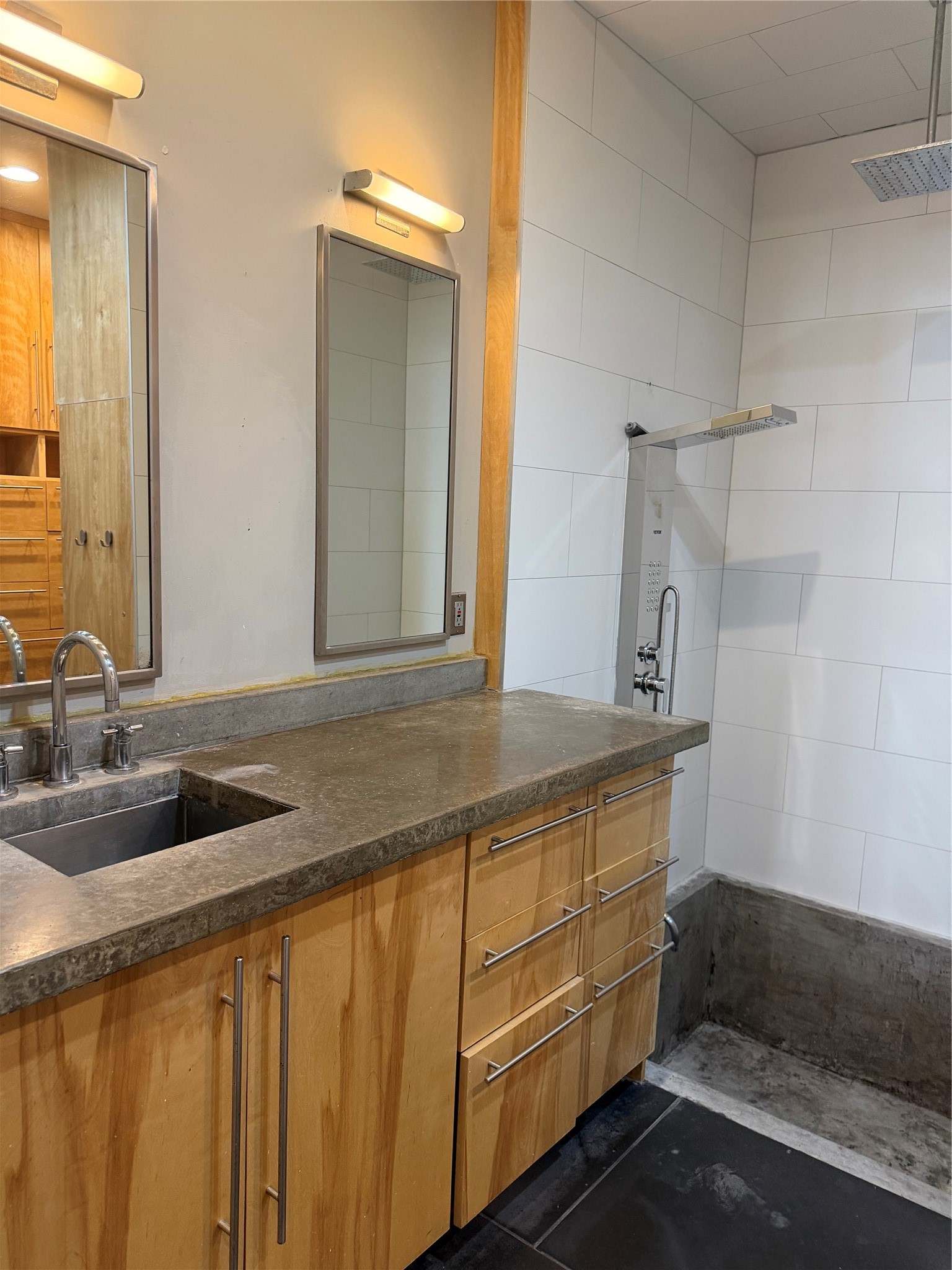 4530 Walker Street Houston, TX 77023 - Photo 11 of 17 a bathroom with a sink and a mirror