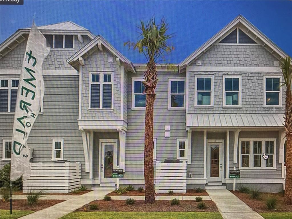 79 Pine Lands Loop East Inlet Beach, FL 32461 - Photo 1 of 1 a front view of a house with a yard