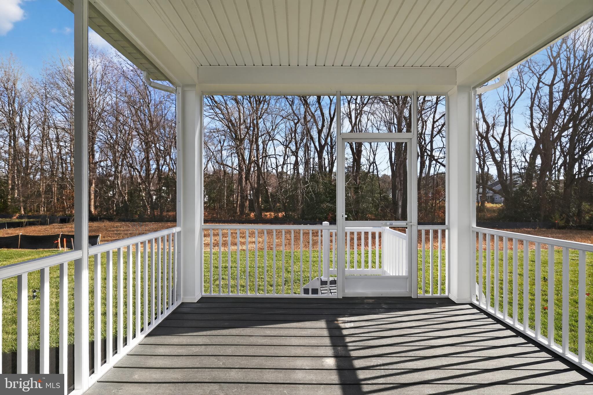 14956 Channel Run Ellendale, DE 19941 - Photo 12 of 28 a view of a porch with wooden floor and fence