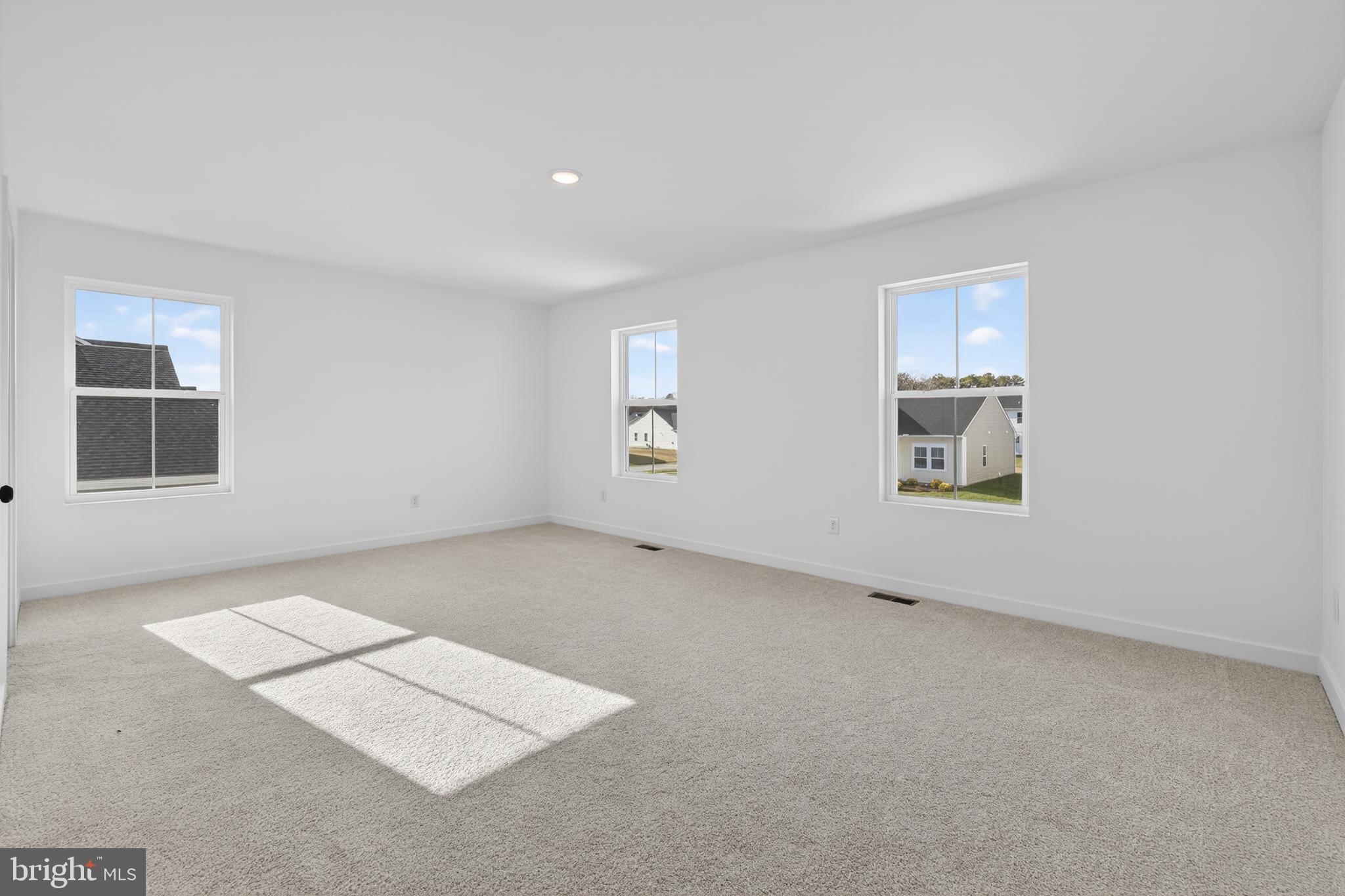 14956 Channel Run Ellendale, DE 19941 - Photo 17 of 28 an empty room with windows