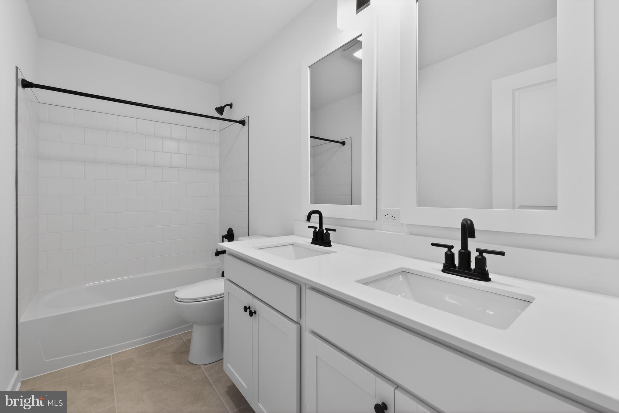 14956 Channel Run Ellendale, DE 19941 - Photo 25 of 28 a bathroom with a sink a toilet and shower