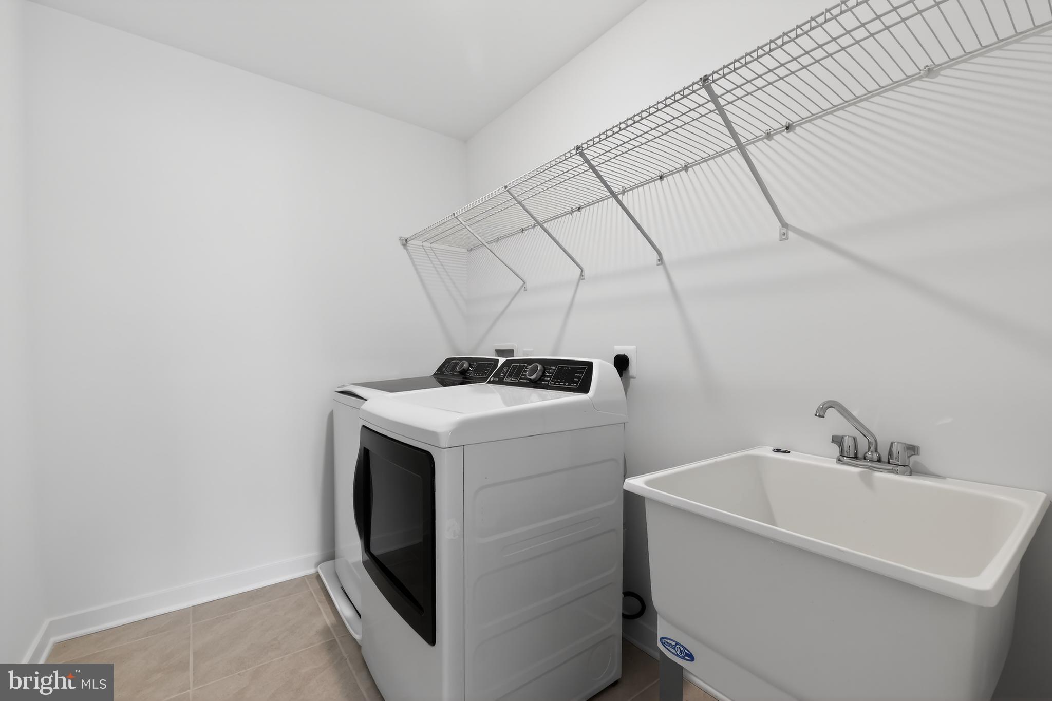 14956 Channel Run Ellendale, DE 19941 - Photo 28 of 28 a utility room with dryer and washer