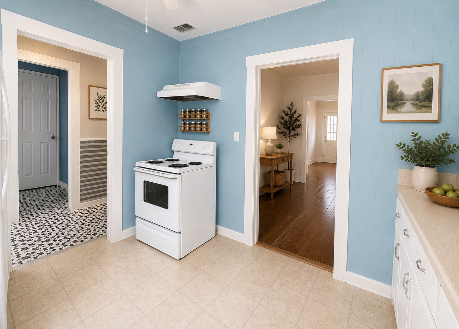 1002 Washburn Street Taylor, TX 76574 - Photo 29 of 29 A compact kitchen with cheerful blue paneling and essential appliances awaits culinary endeavors.