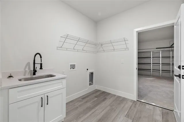 a kitchen with a sink and cabinets