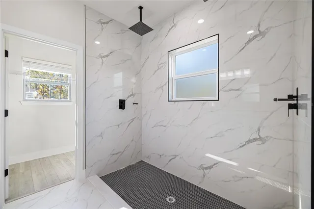 a bathroom with a double vanity sink and a mirror